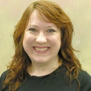 Smiling woman with long red hair